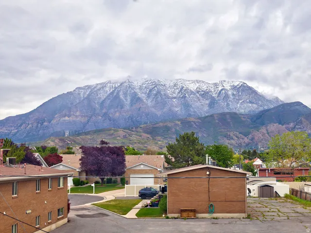 Expansive mountain range backdrop with snow-capped peaks