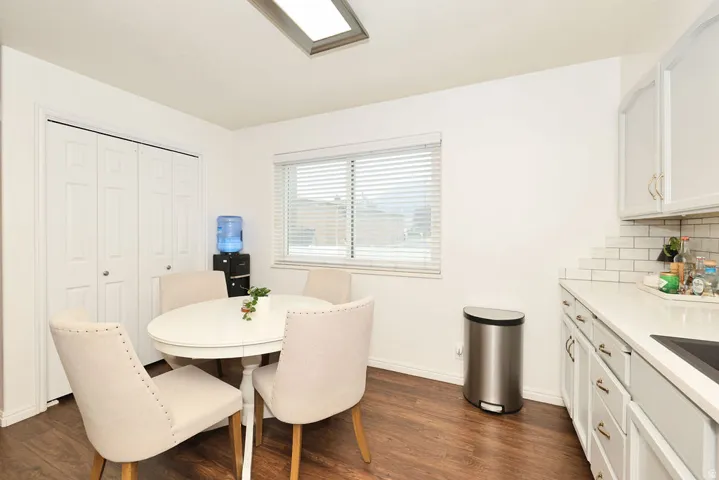 Bright kitchen space featuring wood-finish flooring