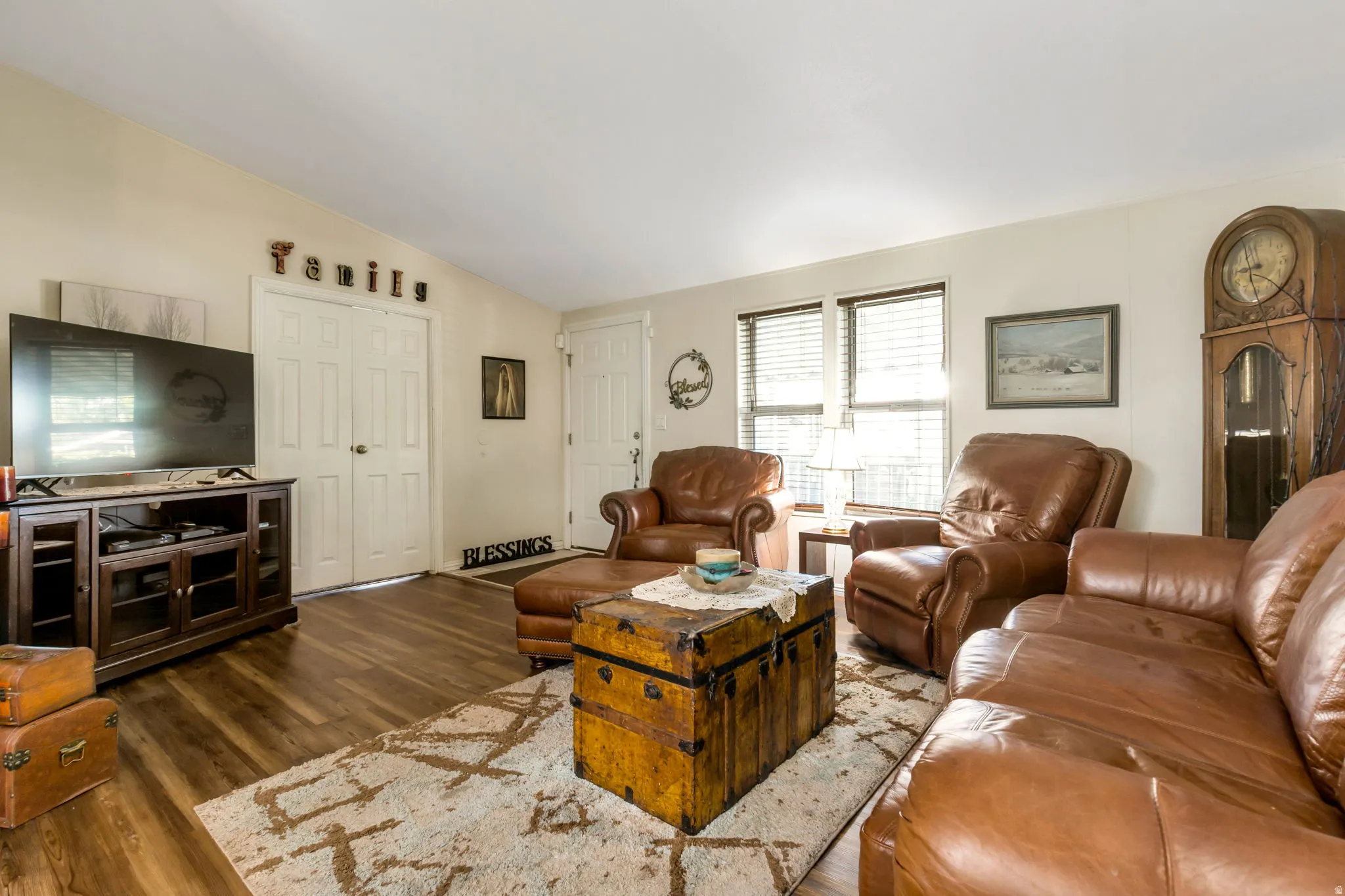 Living area featuring wood-finish flooring, light-colored walls, and a white ceiling