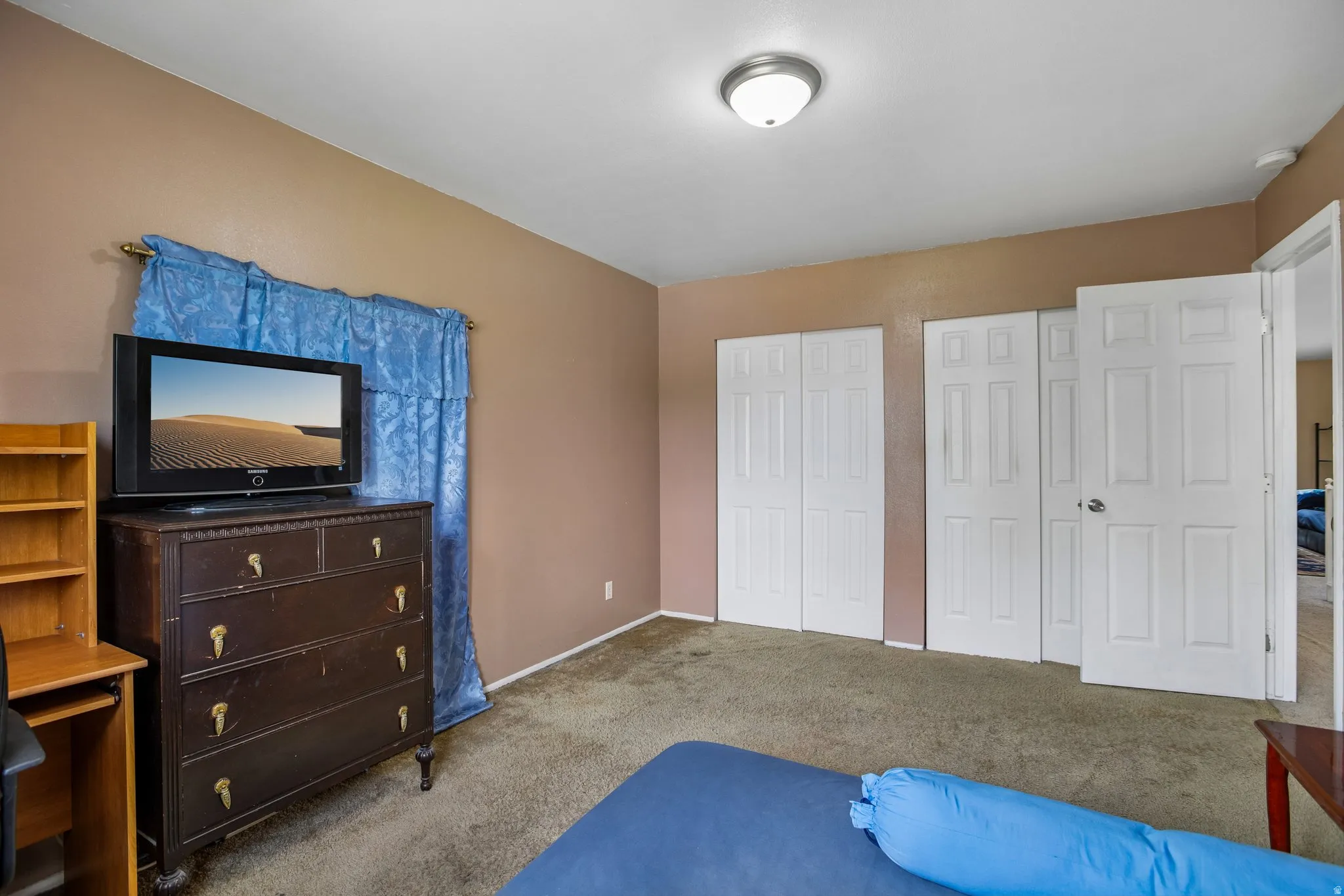 Room featuring neutral-toned walls and carpeted flooring