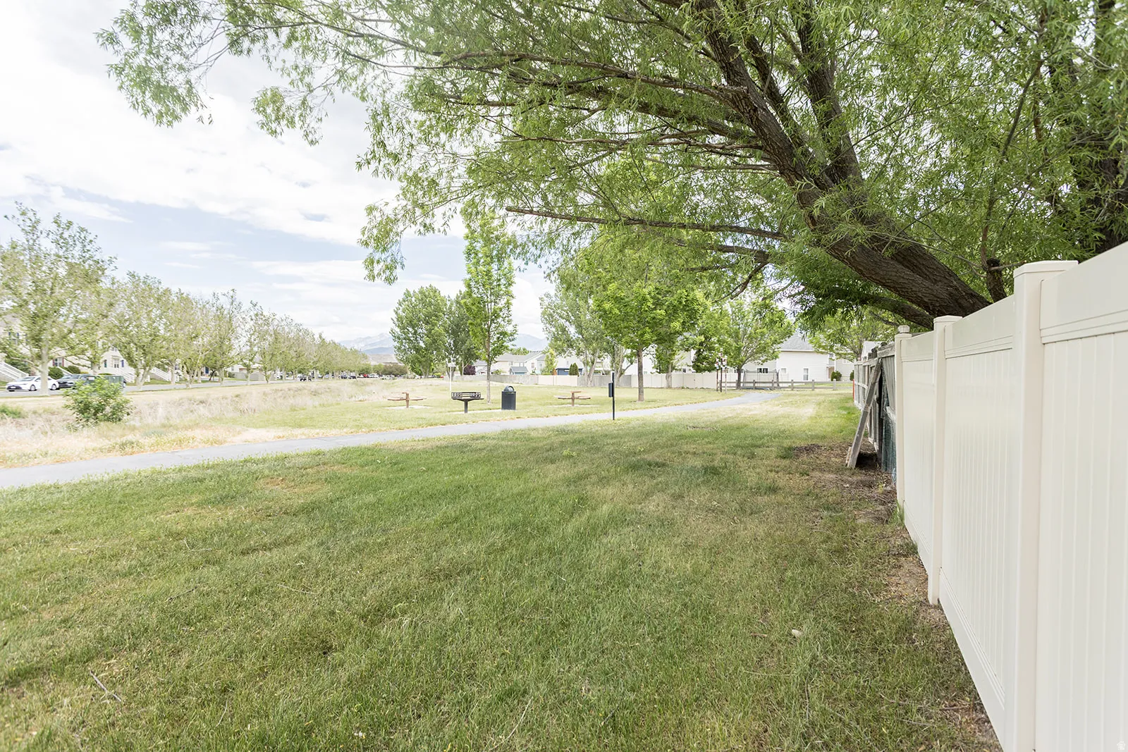 Gate from back yard to city maintained space with walking trails.