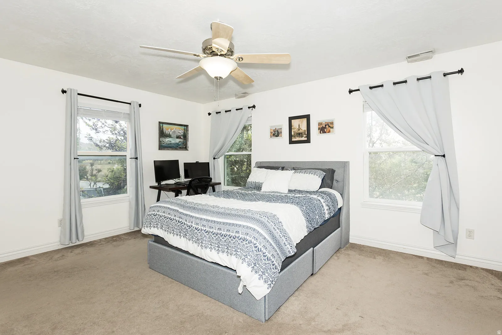 Bright bedroom with two windows providing natural light