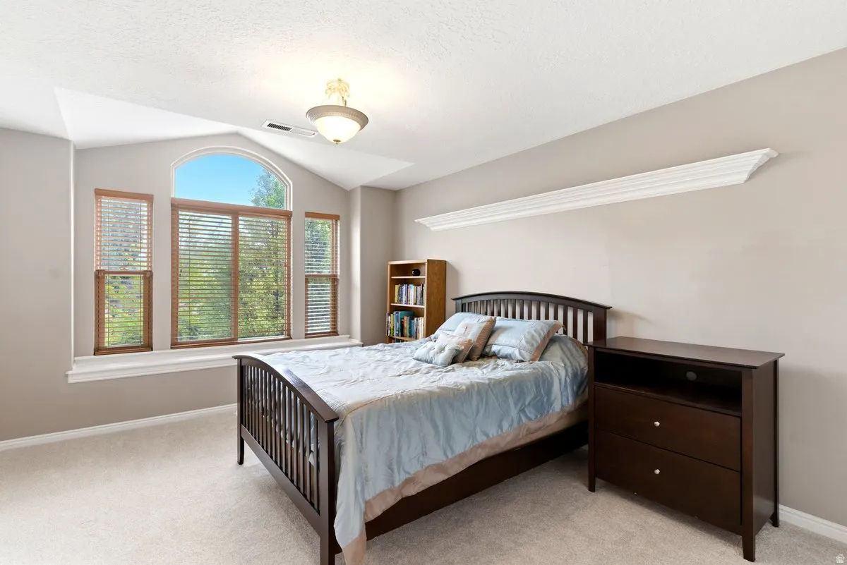 Arched and rectangular windows with wood blinds, providing exterior views