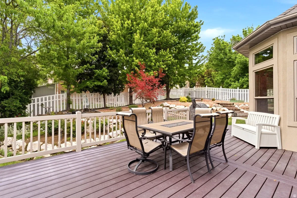 Expansive outdoor deck featuring composite decking and a white railing system