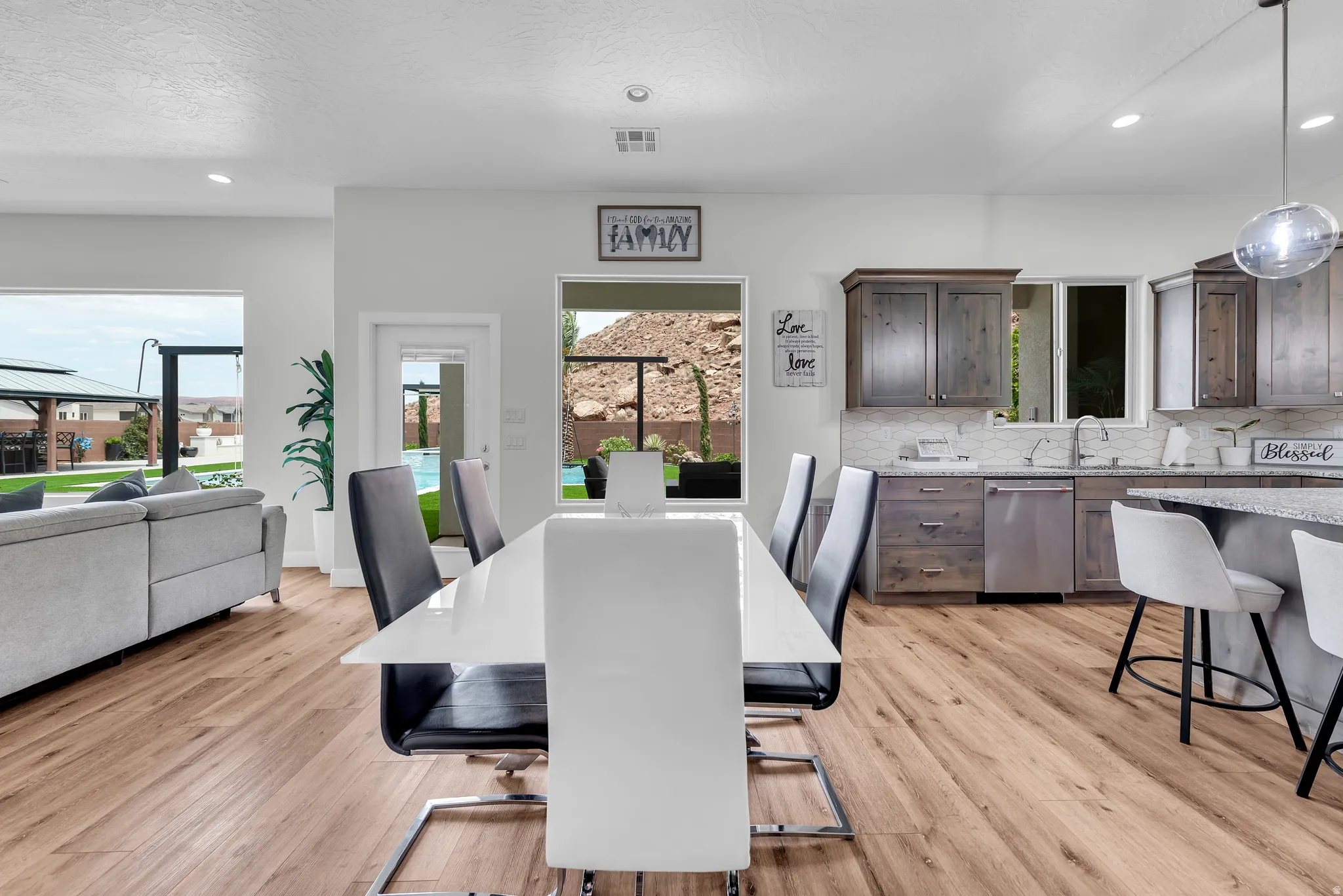 Open-concept living space featuring wood-finish flooring throughout