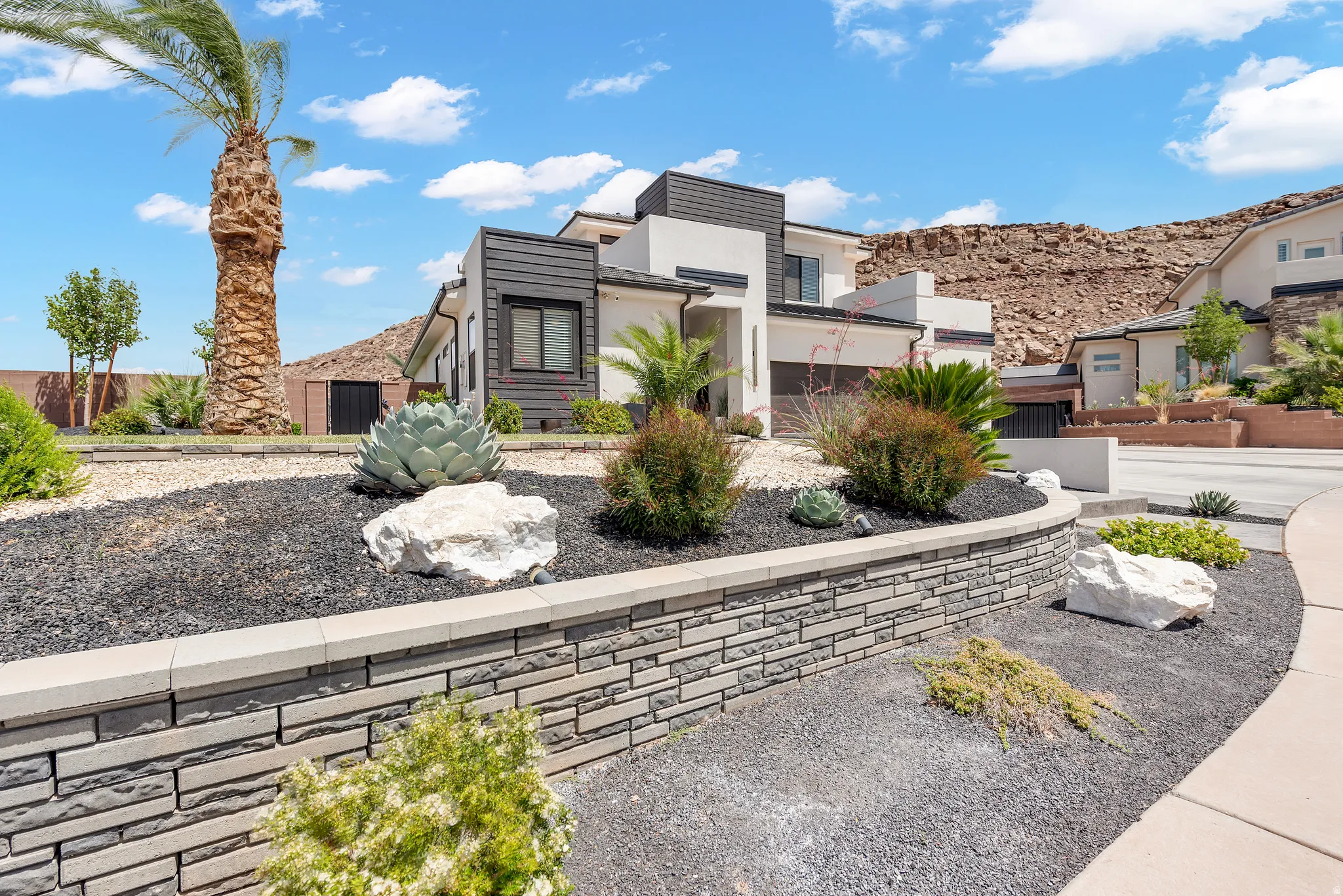 Contemporary exterior featuring light stucco and dark horizontal siding