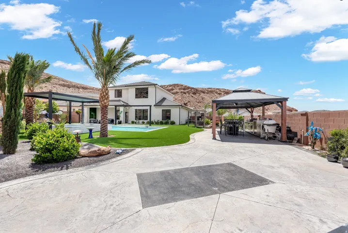 Expansive stamped concrete driveway with a dedicated covered parking structure