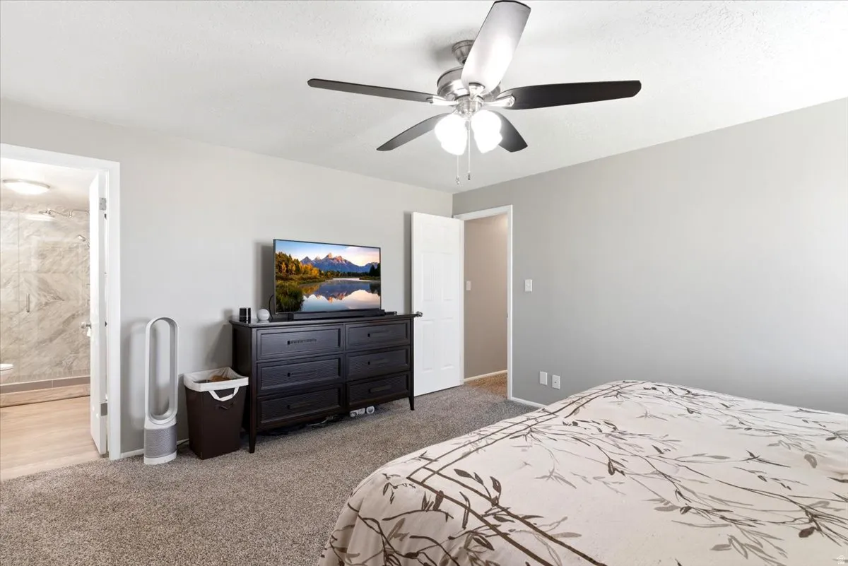 Spacious room featuring neutral carpeting and light gray walls