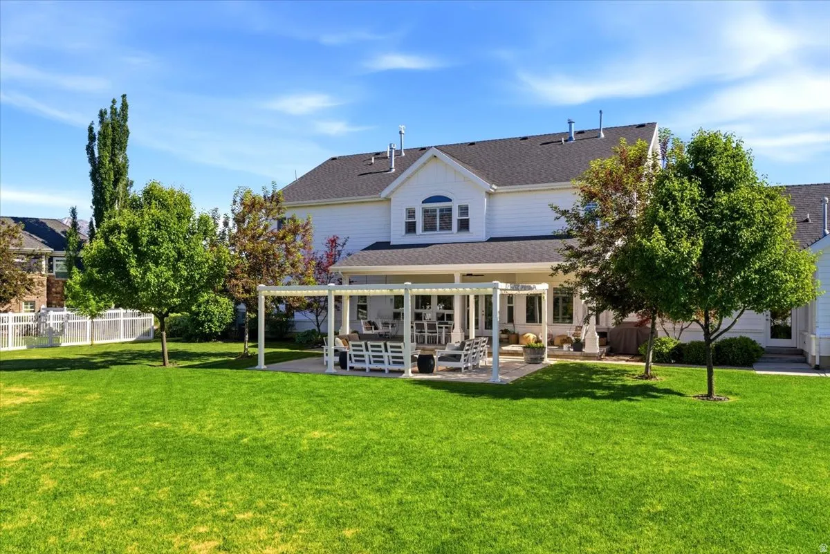Expansive green lawn with mature trees