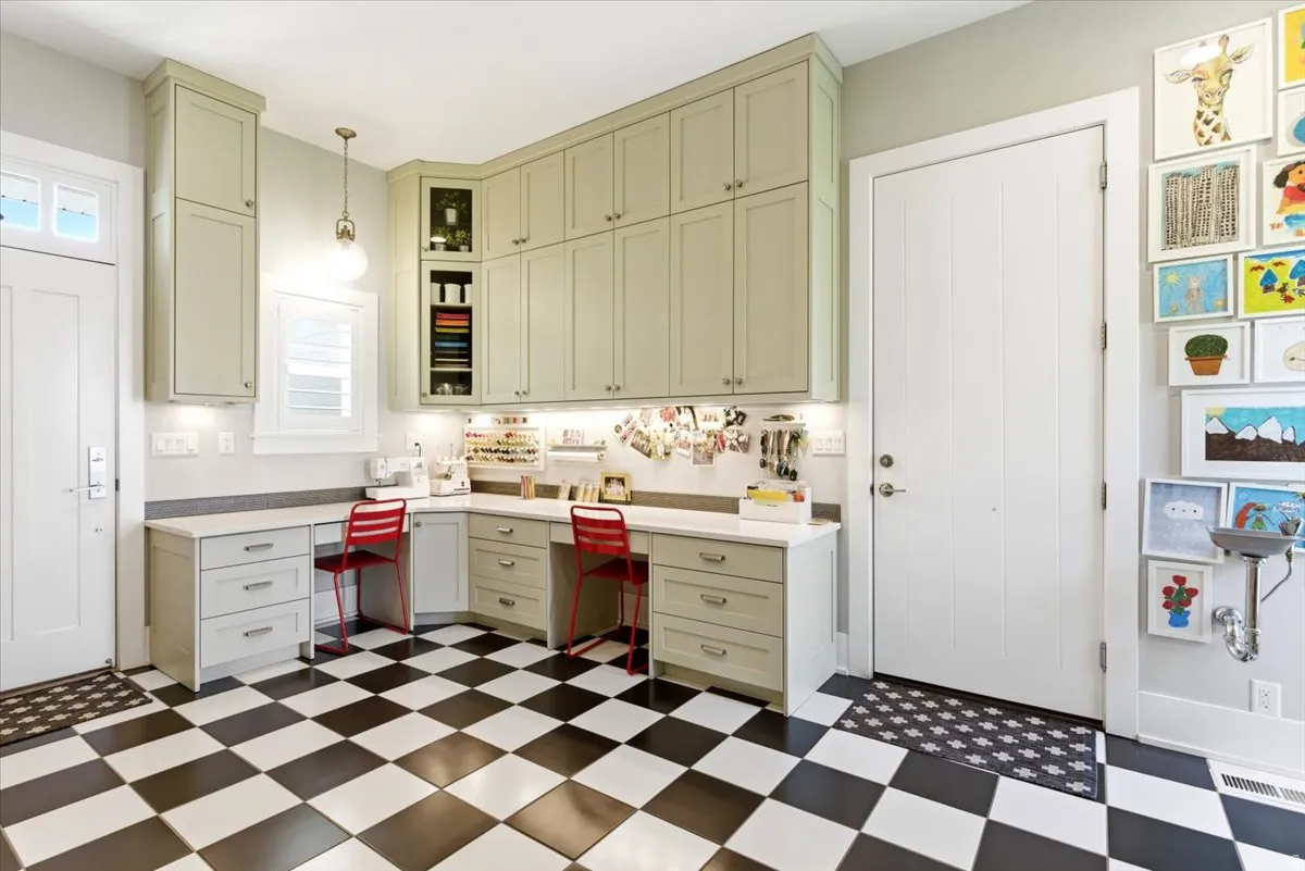 Craft room featuring extensive built-in cabinetry, under-cabinet lighting, and a white countertop