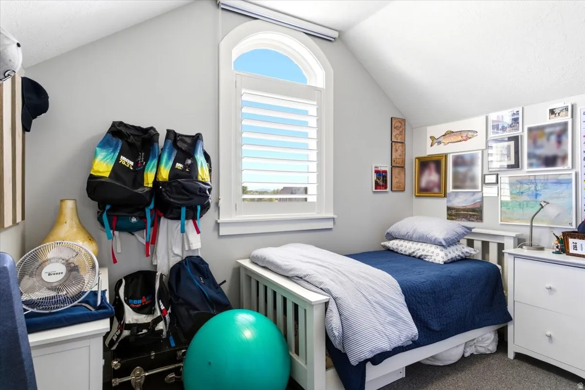 Arched window with plantation shutters provides natural illumination