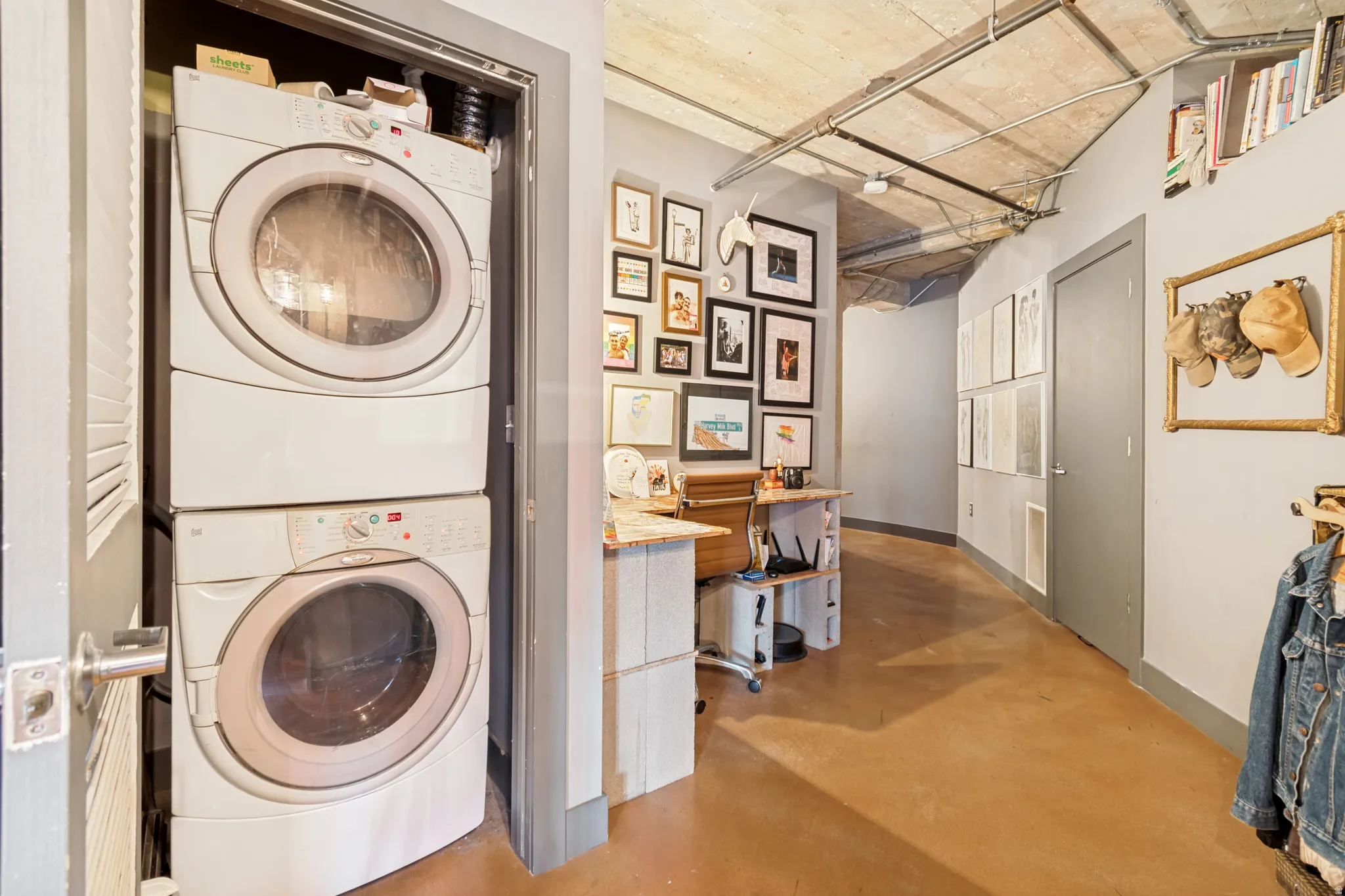 Integrated stacked washer and dryer in a dedicated closet