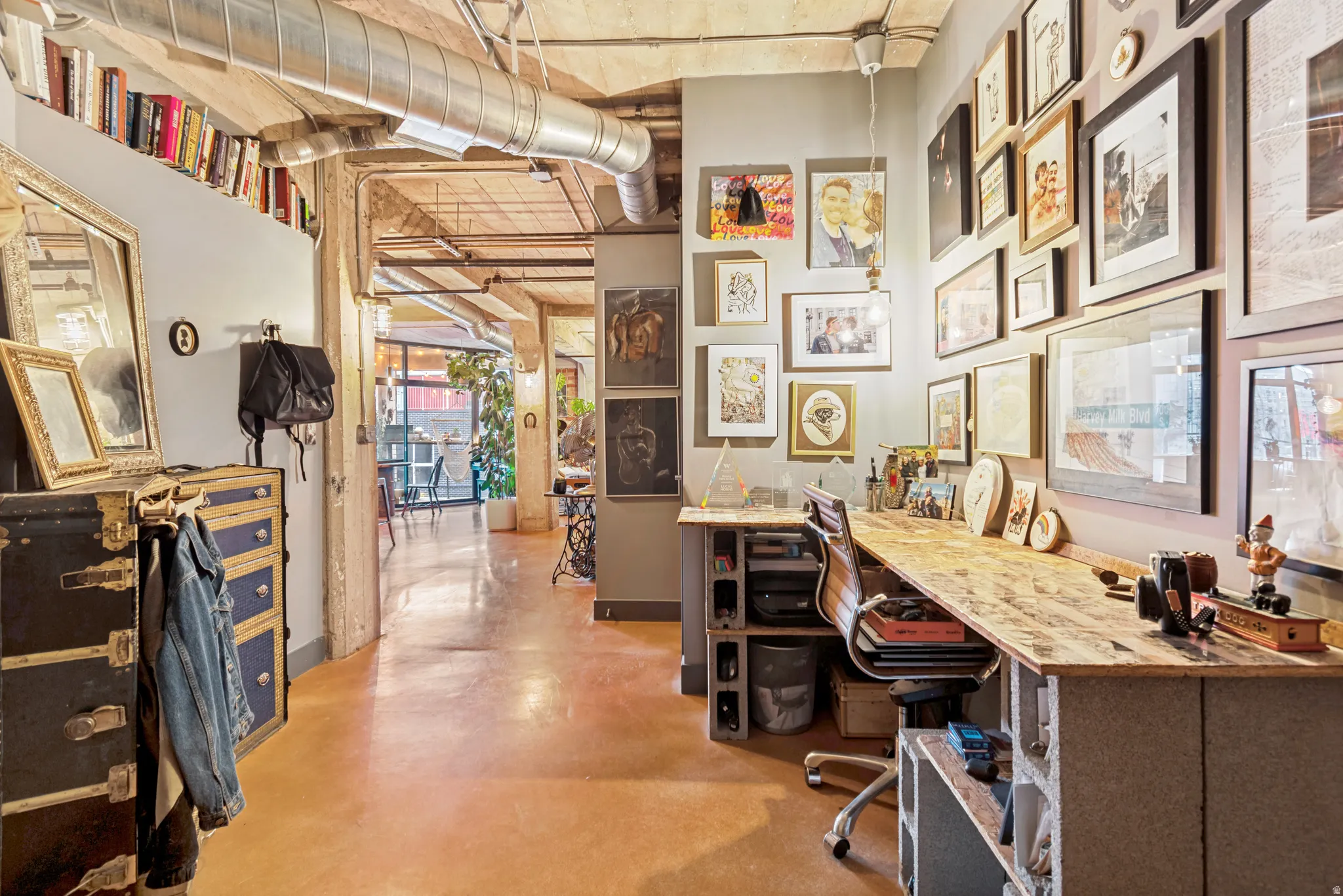 Expansive concrete flooring with exposed ductwork and industrial ceiling elements