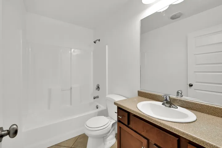 White paneled tub and shower combination