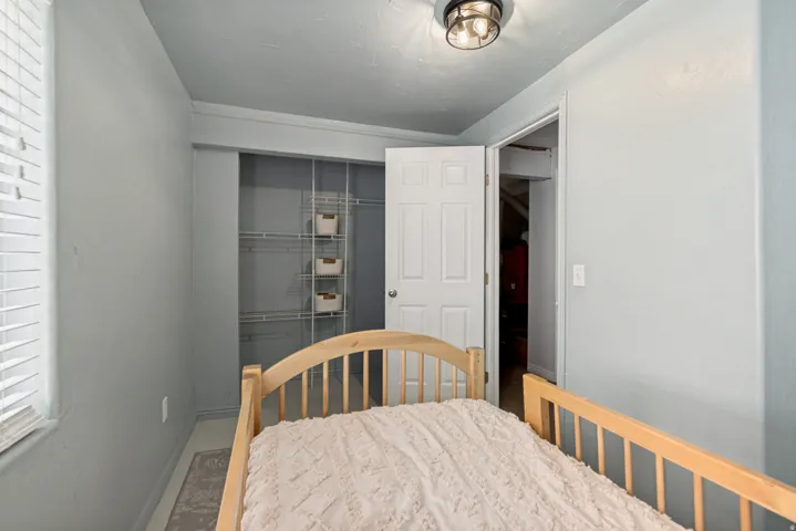 Room with light blue walls, a white ceiling, and a flush-mount ceiling light fixture