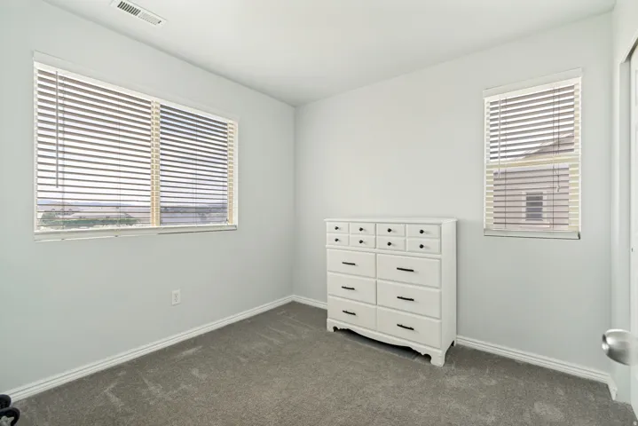 Light gray walls with a matching carpeted floor