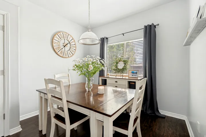 Dark wood-finish flooring complements light wall paint and white trim