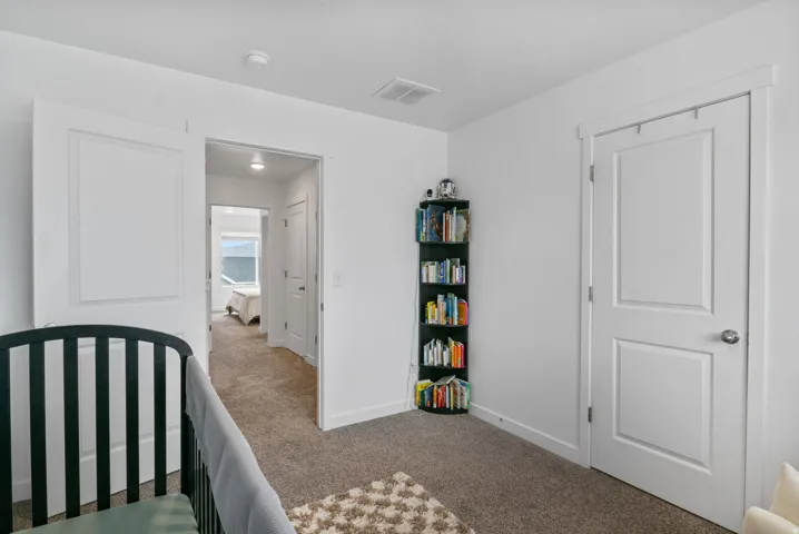 Plush carpet flooring complements crisp white walls