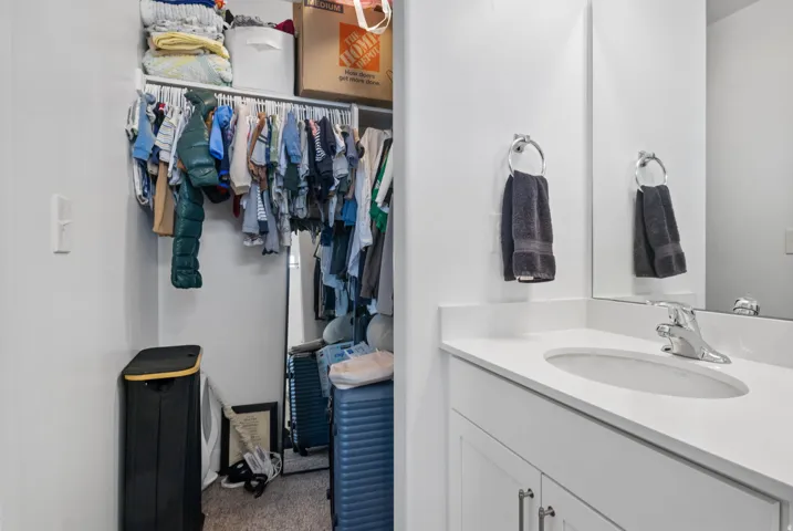 Bathroom vanity with an integrated sink and chrome faucet
