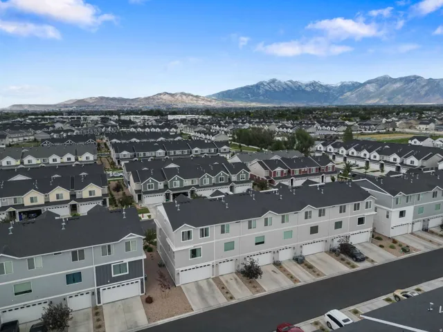 Expansive residential community featuring uniform architectural styles and mountain scenery
