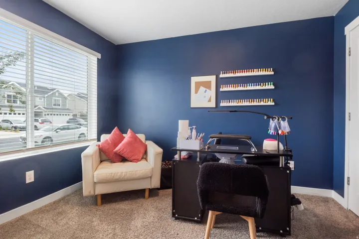 Deep blue accent wall with white trim