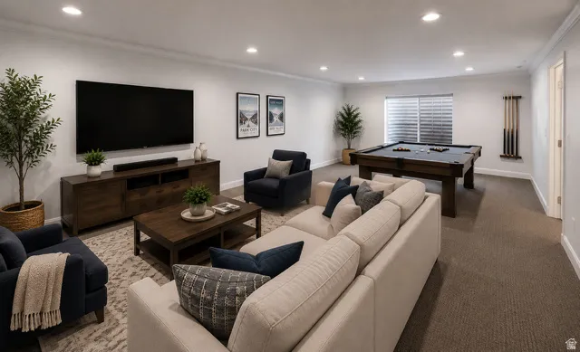 Spacious recreation room featuring recessed lighting, a built-in entertainment console, a large window with horizontal blinds, and a billiards area