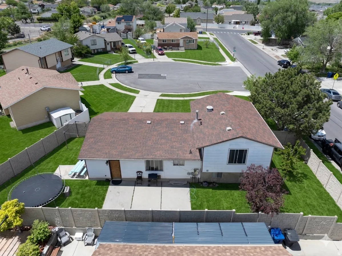 Ai enhanced Aerial perspective showcasing the residential property