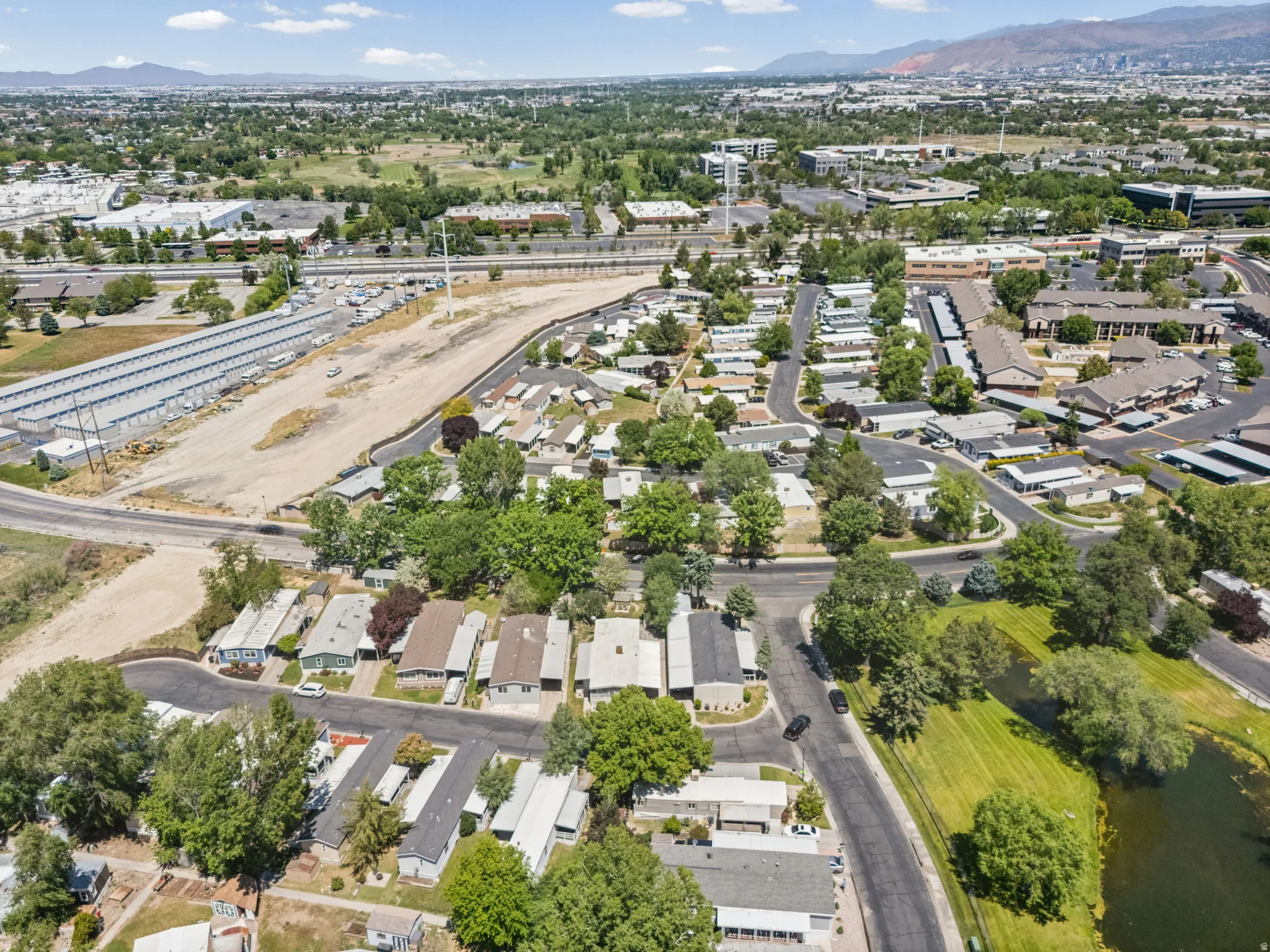Aerial perspective showcasing a residential community with mature landscaping
