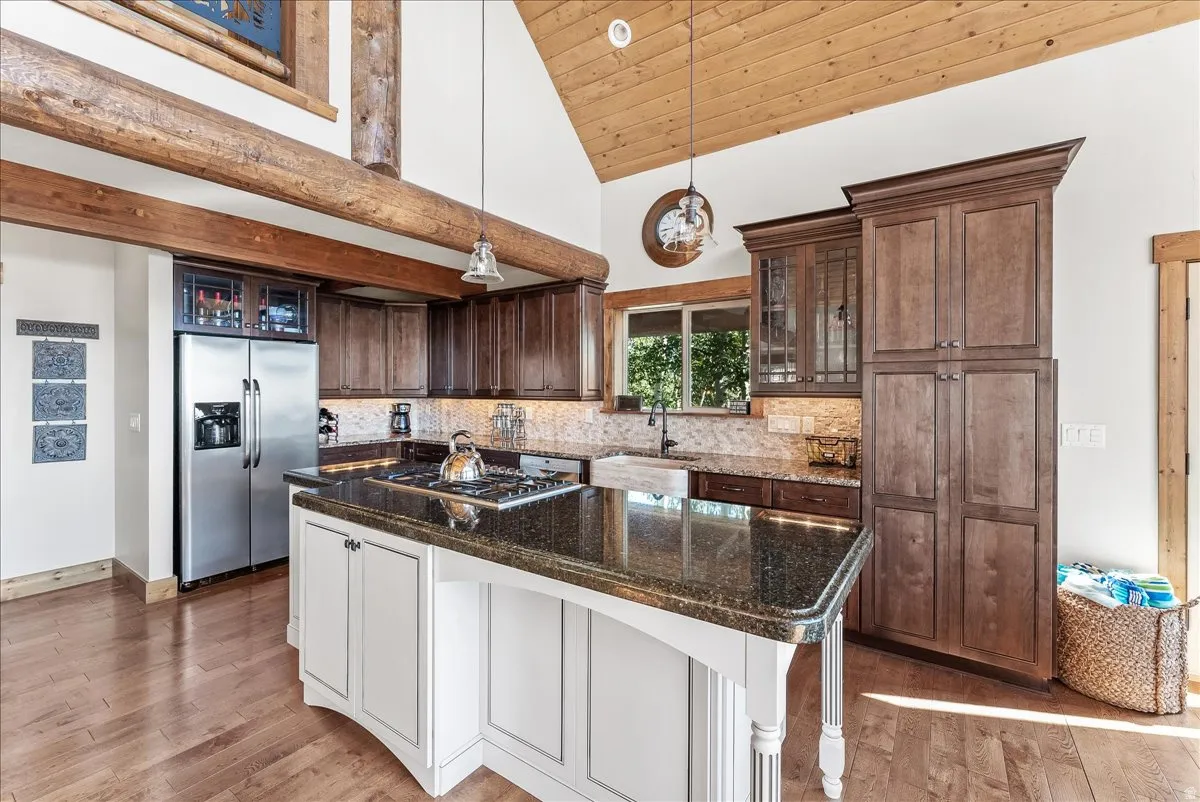 Vaulted wood-paneled ceiling with exposed wood beams
