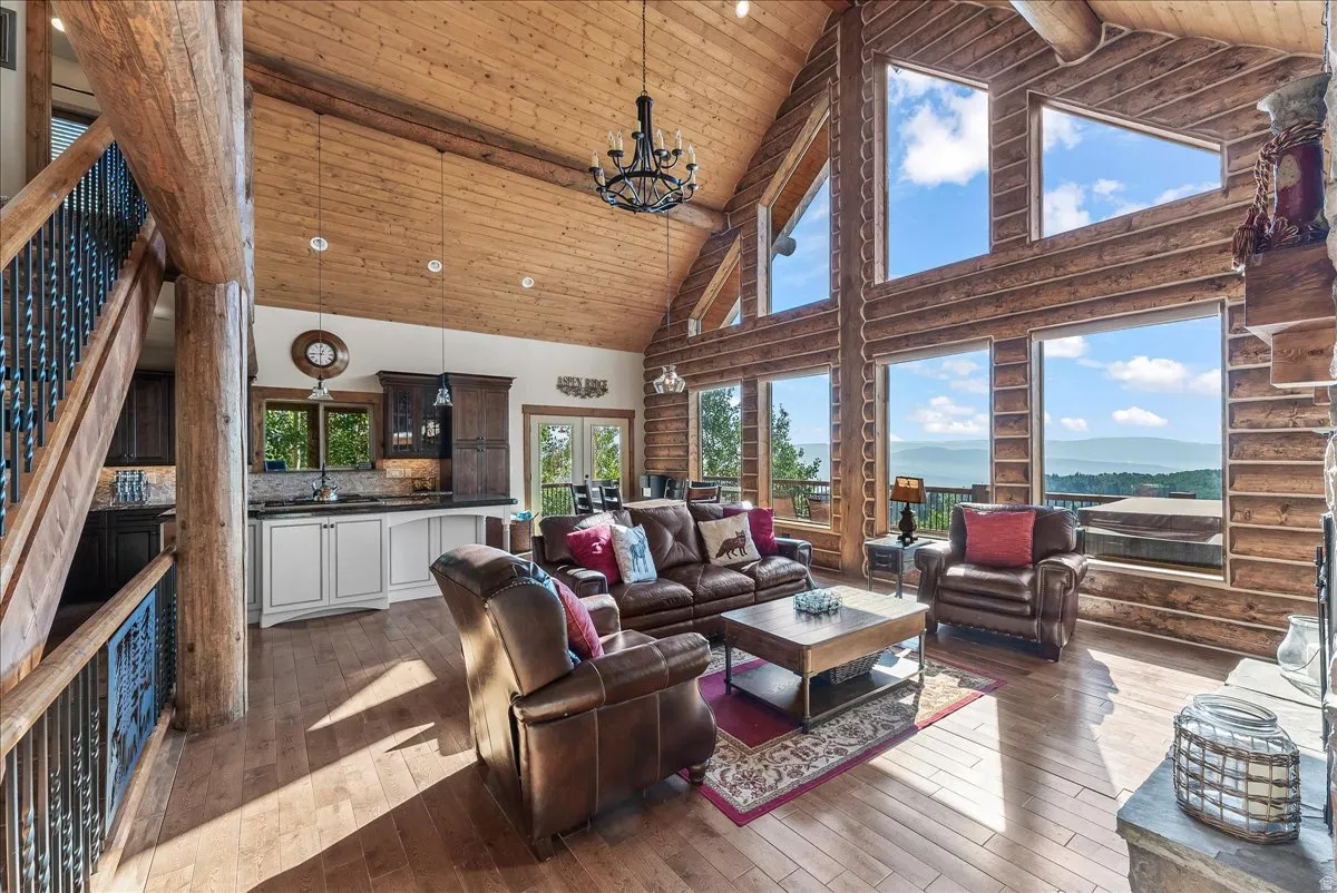Vaulted ceiling featuring exposed wood beams and paneling
