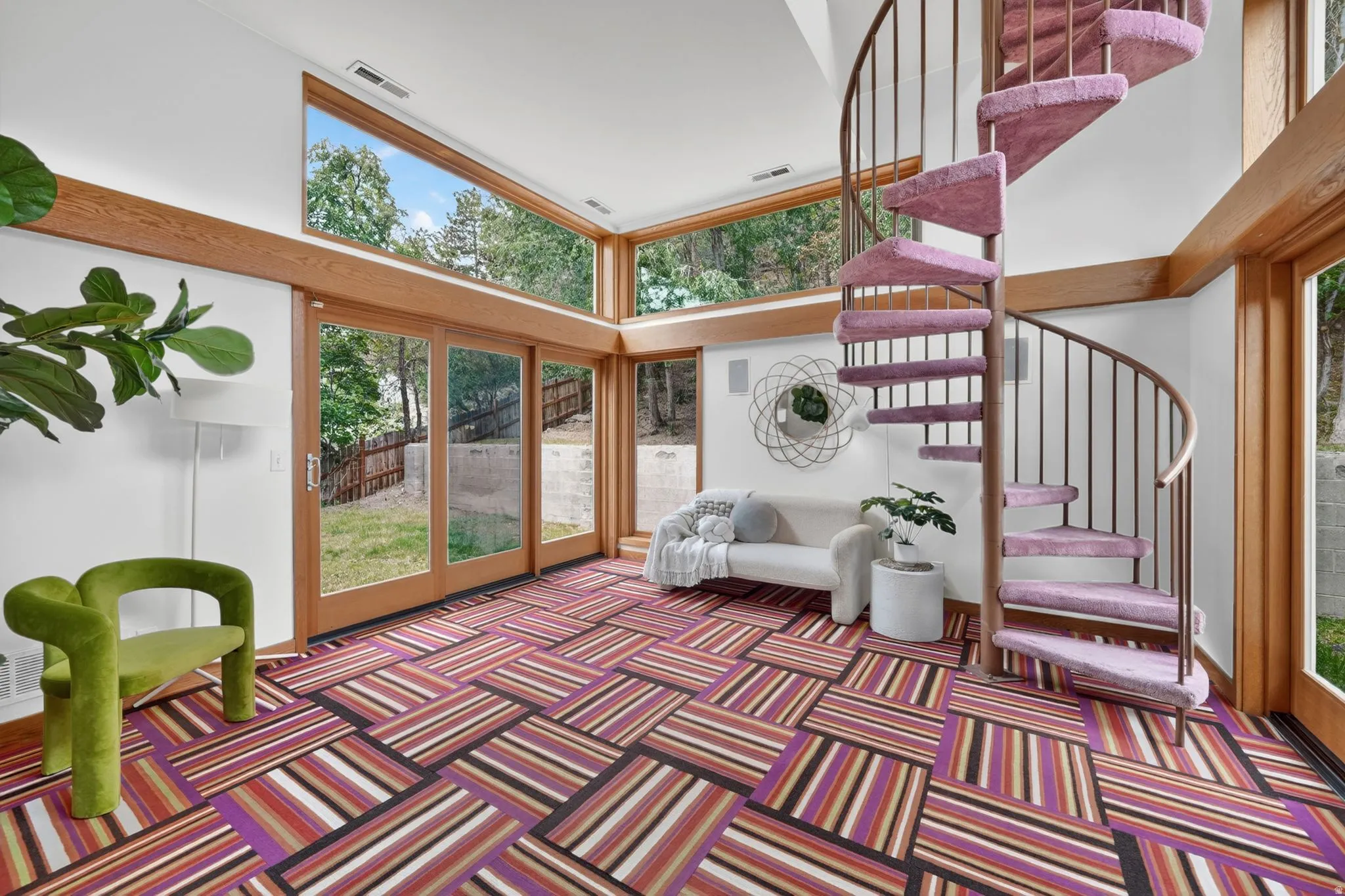 Sunroom with lots of natural light and a spiral staircase