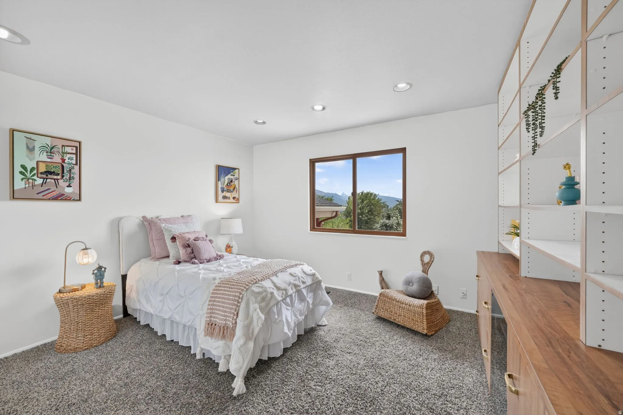 Large bedroom with floor to ceiling custom shelving