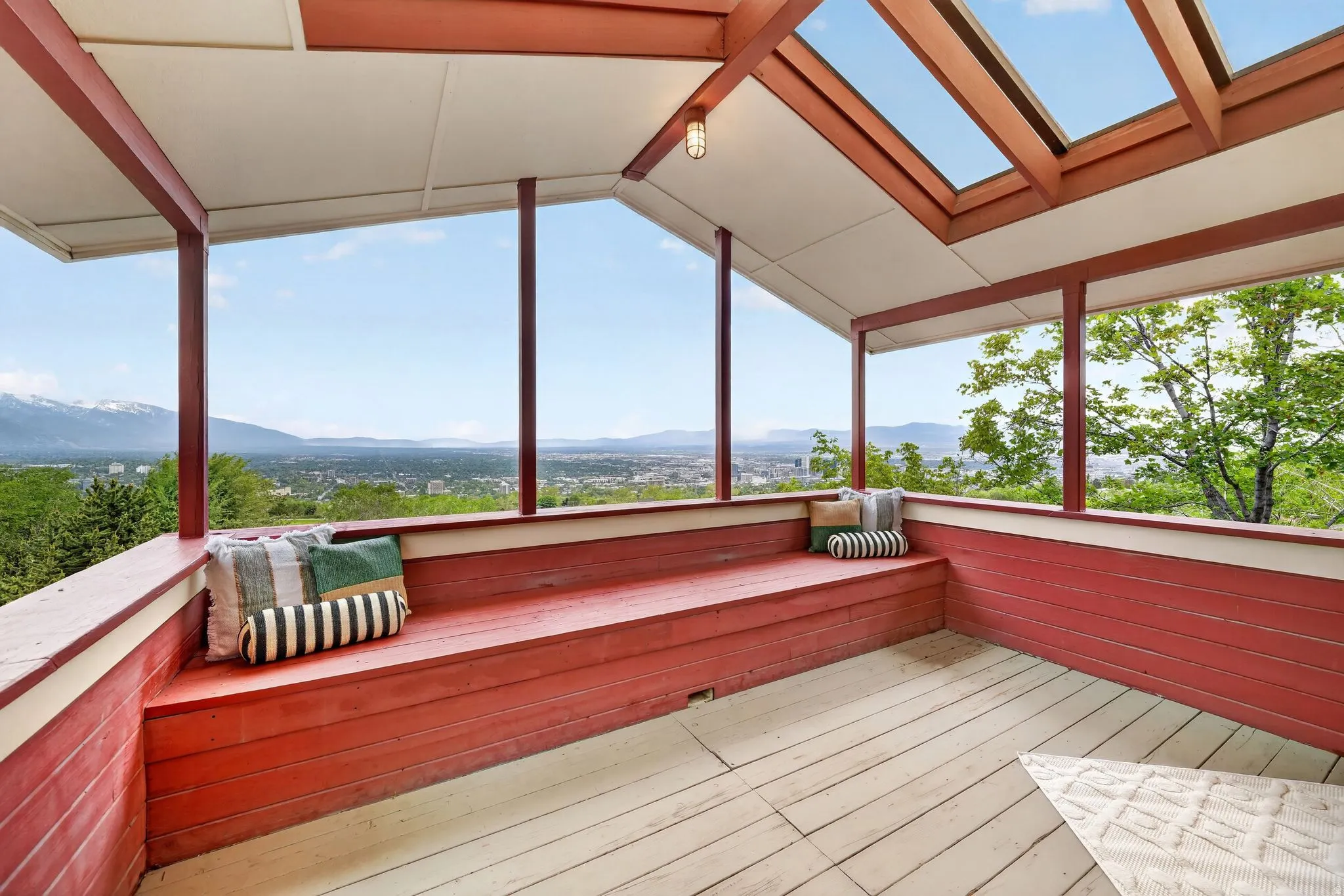 Covered rooftop deck featuring panoramic mountain and city scenery