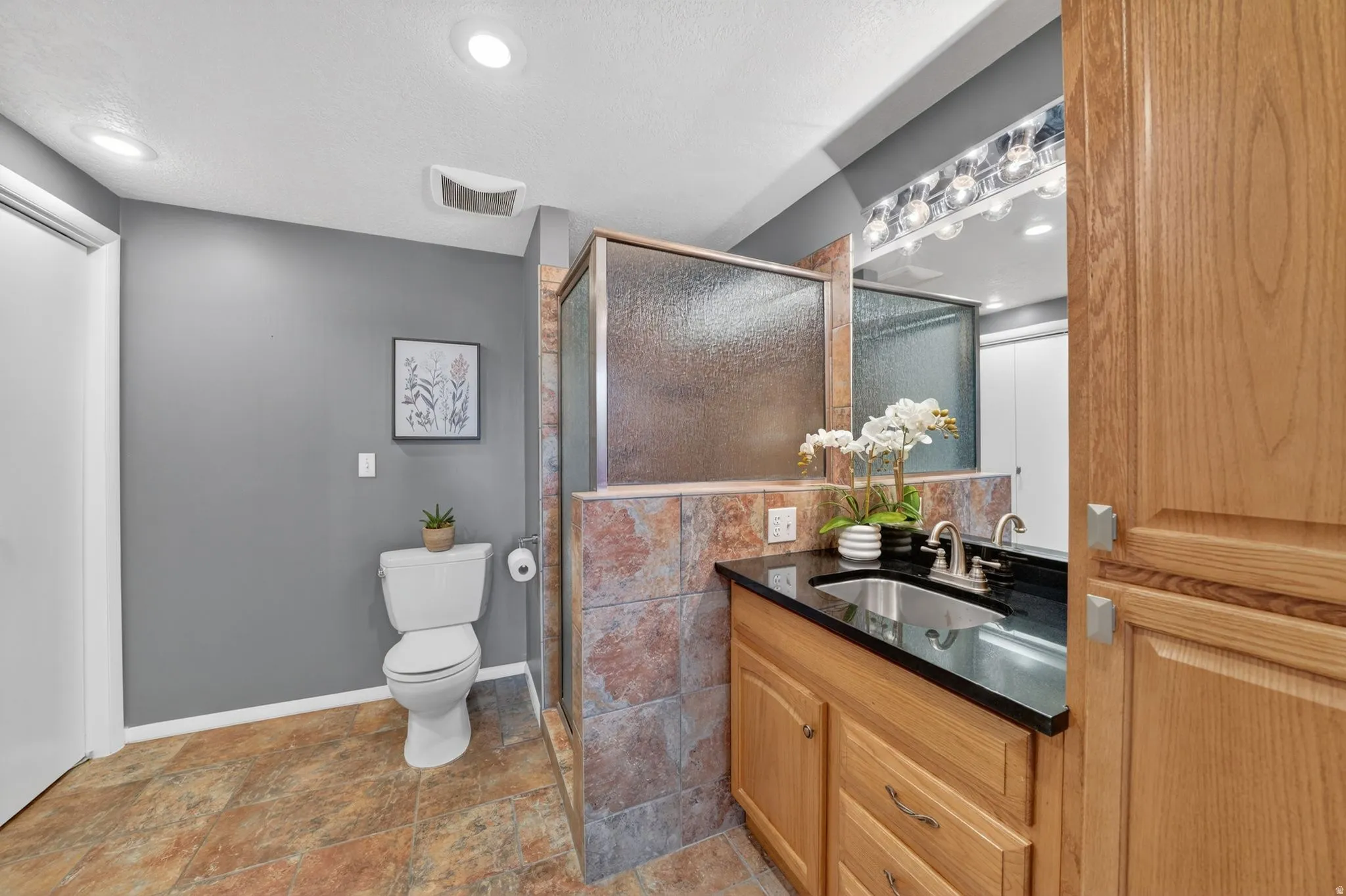 Large bathroom with laundry inside closet. Washer & dryer included