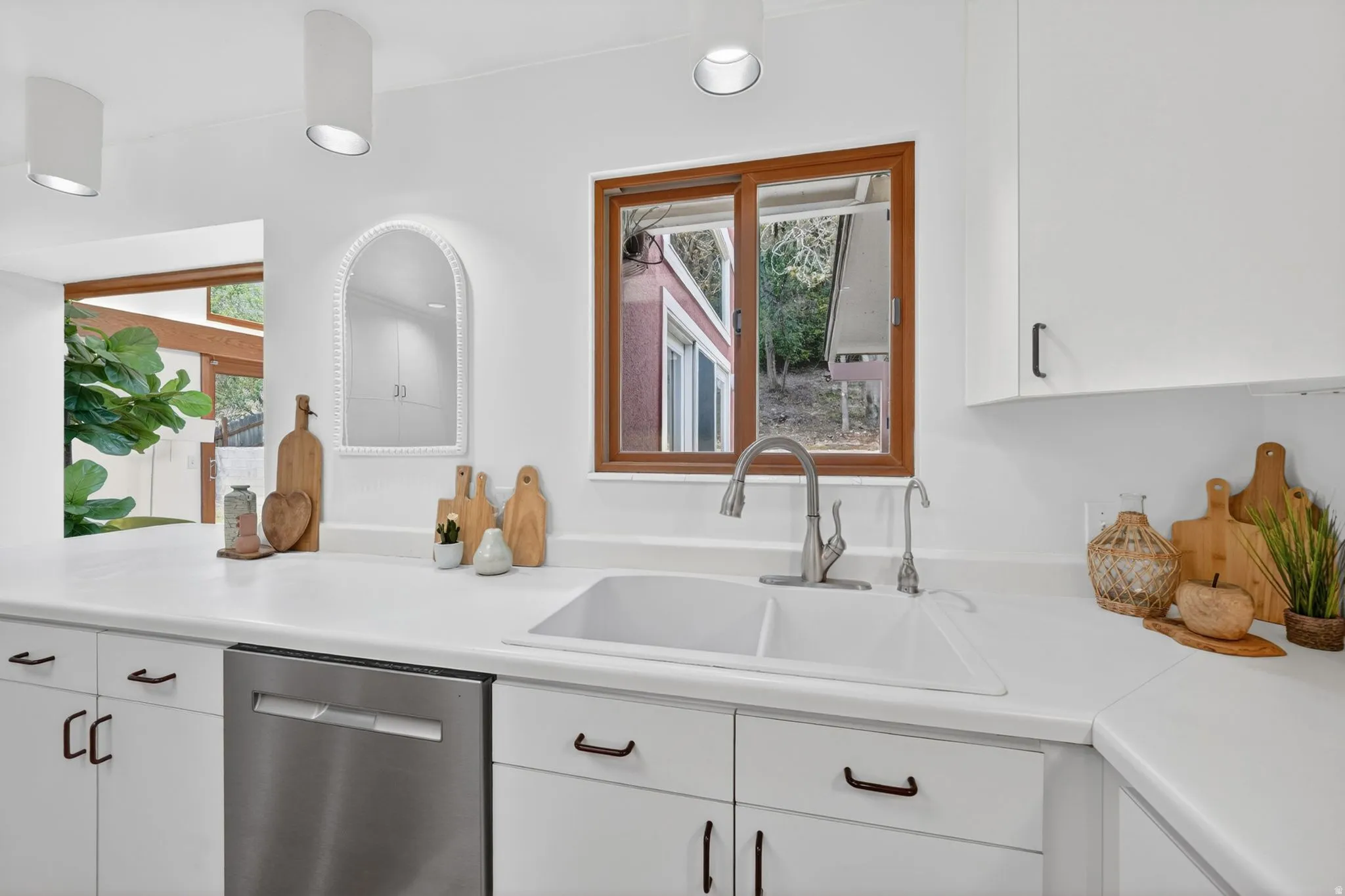 Bright kitchen that leads into a one of a kind sunroom