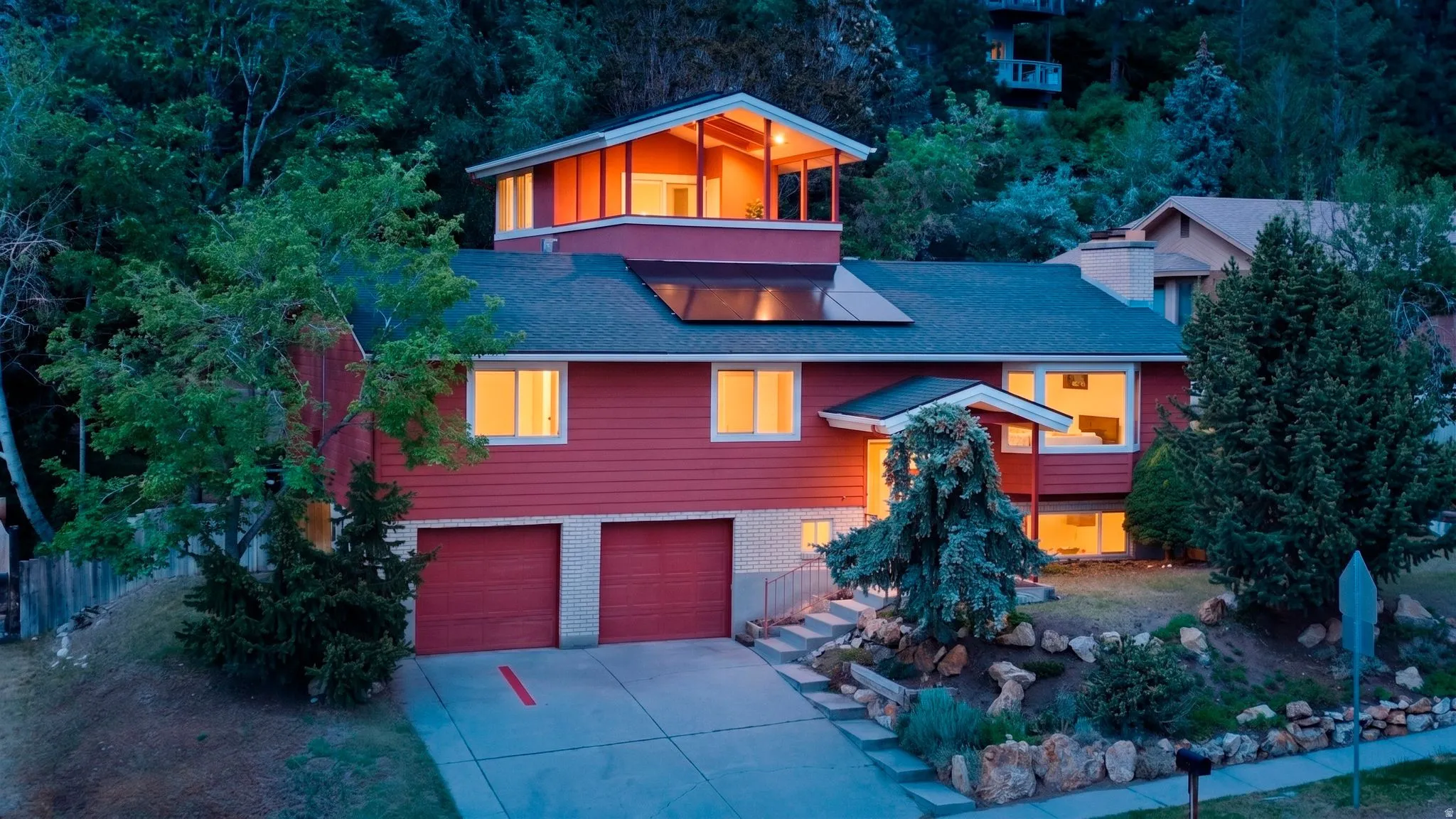Split-level residence featuring a prominent rooftop deck