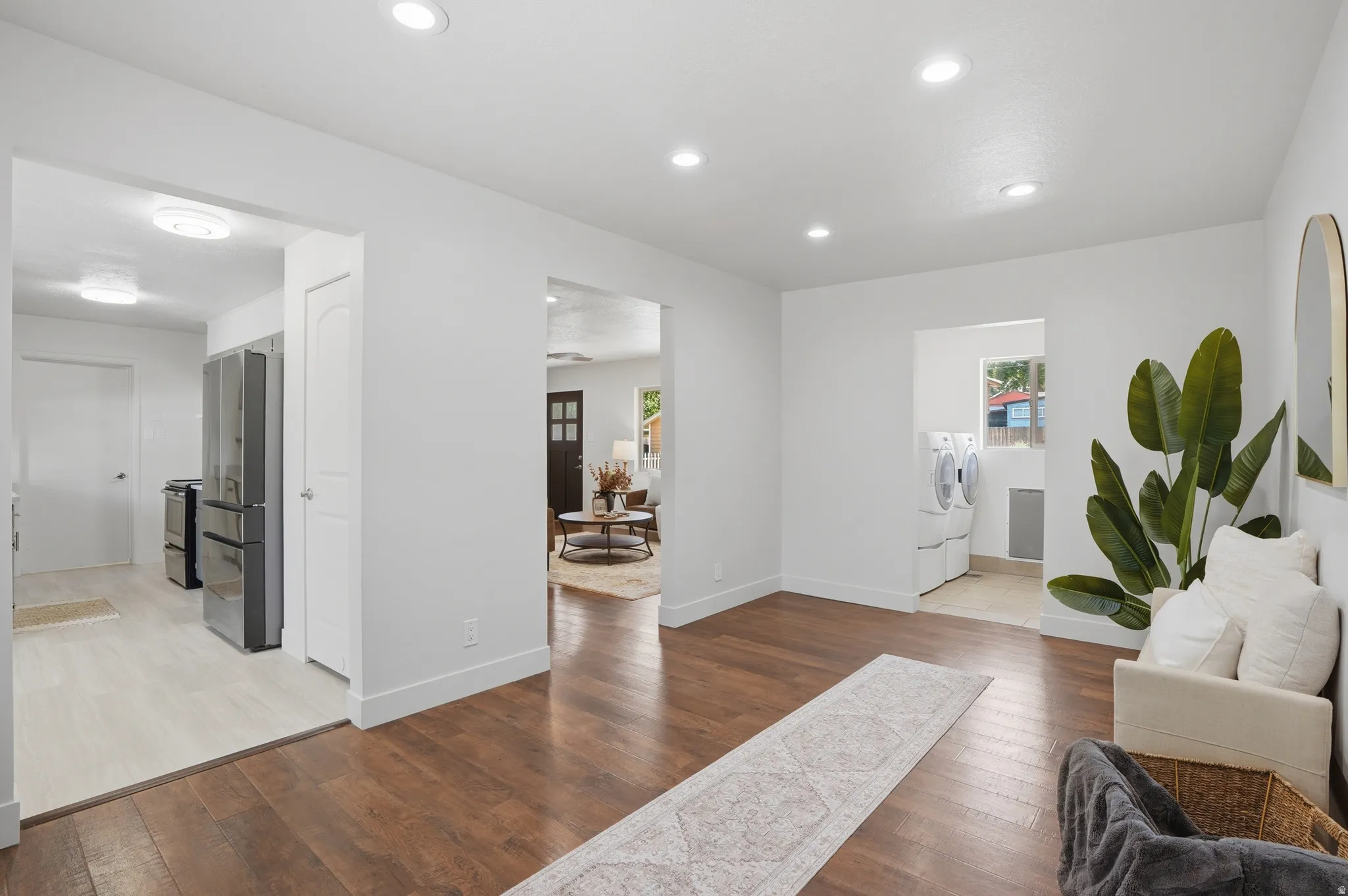 Open concept interior featuring dark wood-finish flooring, recessed lighting, could be used as a den.