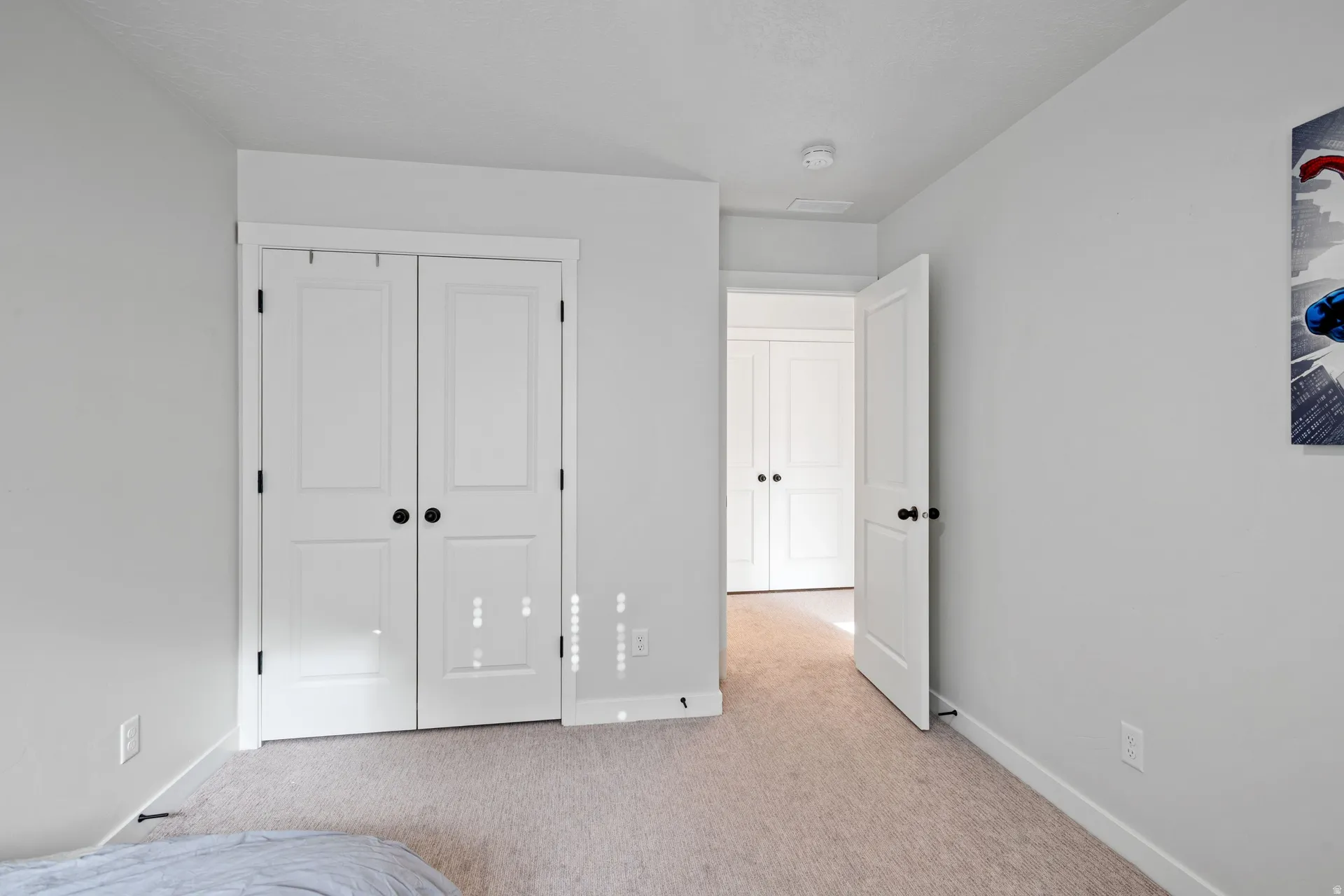 Light-toned carpeting complementing neutral wall tones