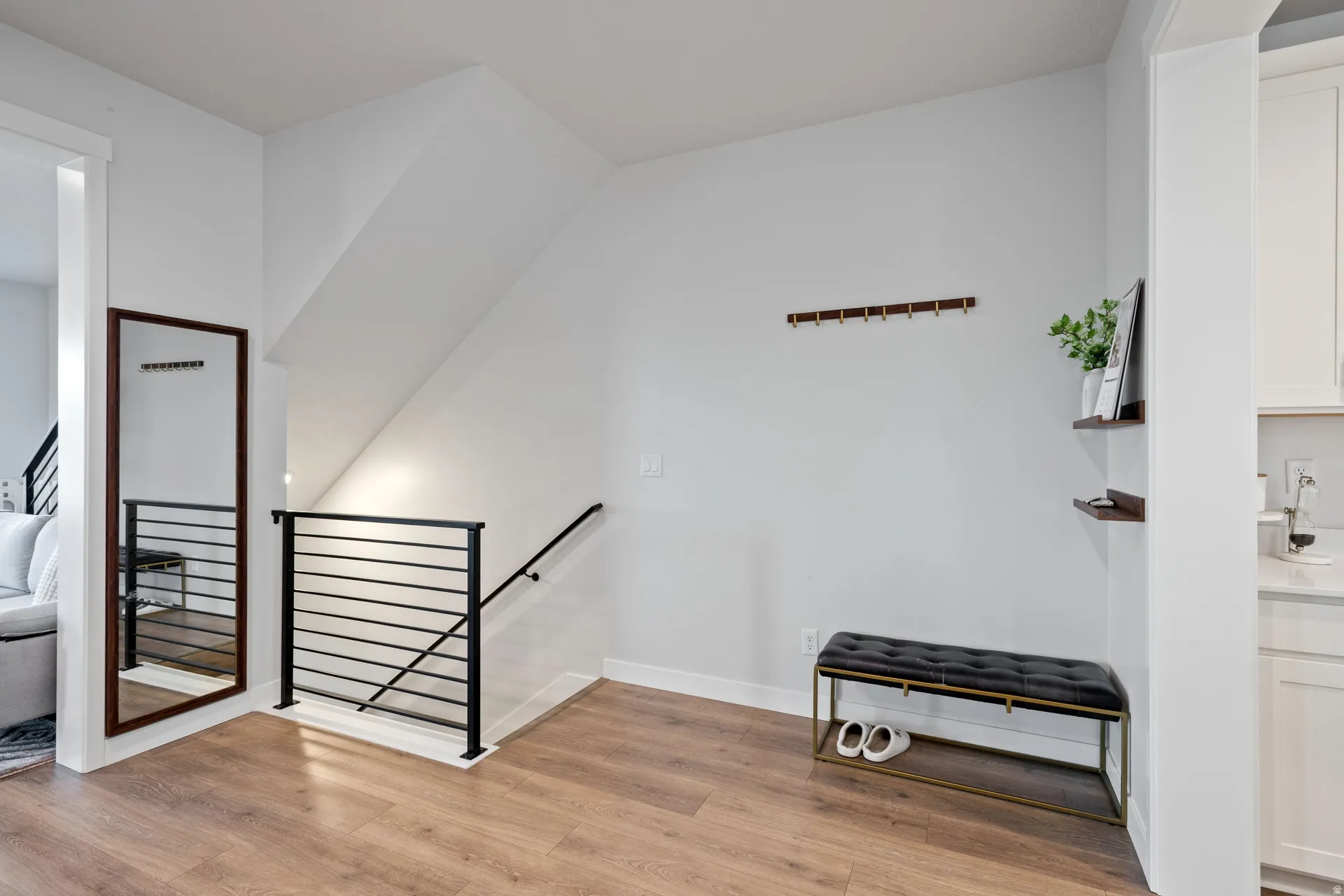 Light wood-finish flooring throughout the space