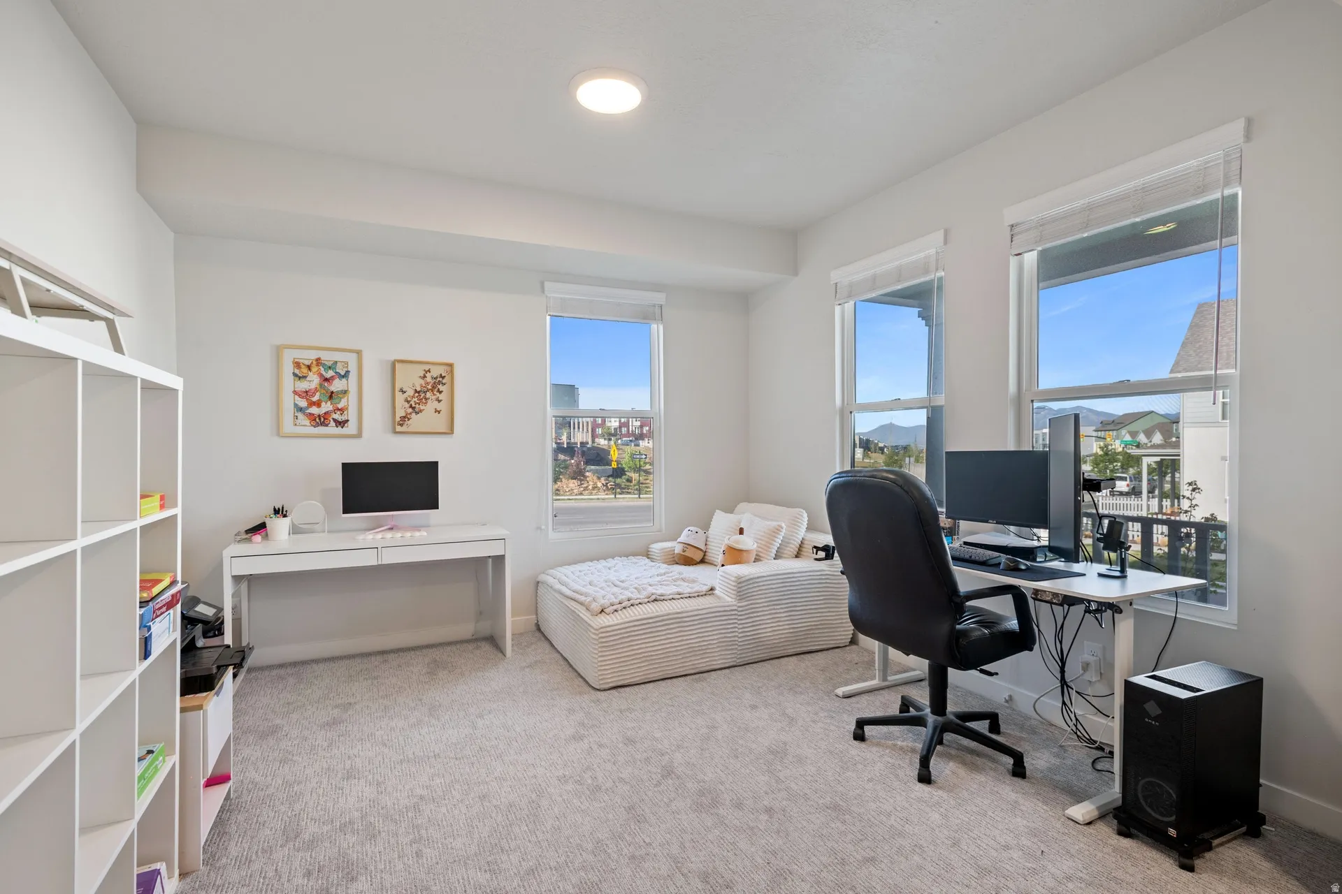 Carpeted room with multiple windows, recessed lighting, and white walls