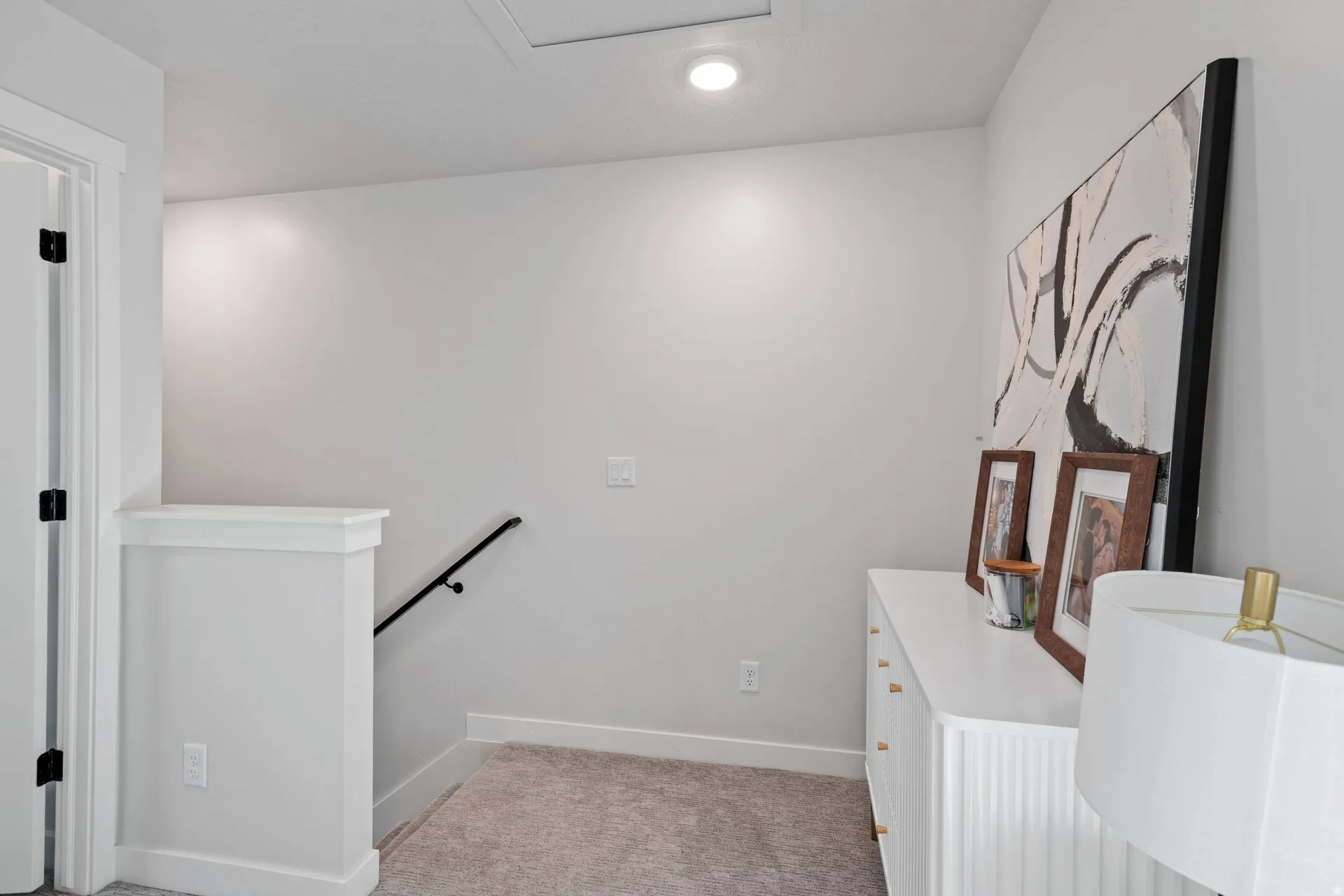 Upper landing featuring recessed lighting and neutral-toned carpeting