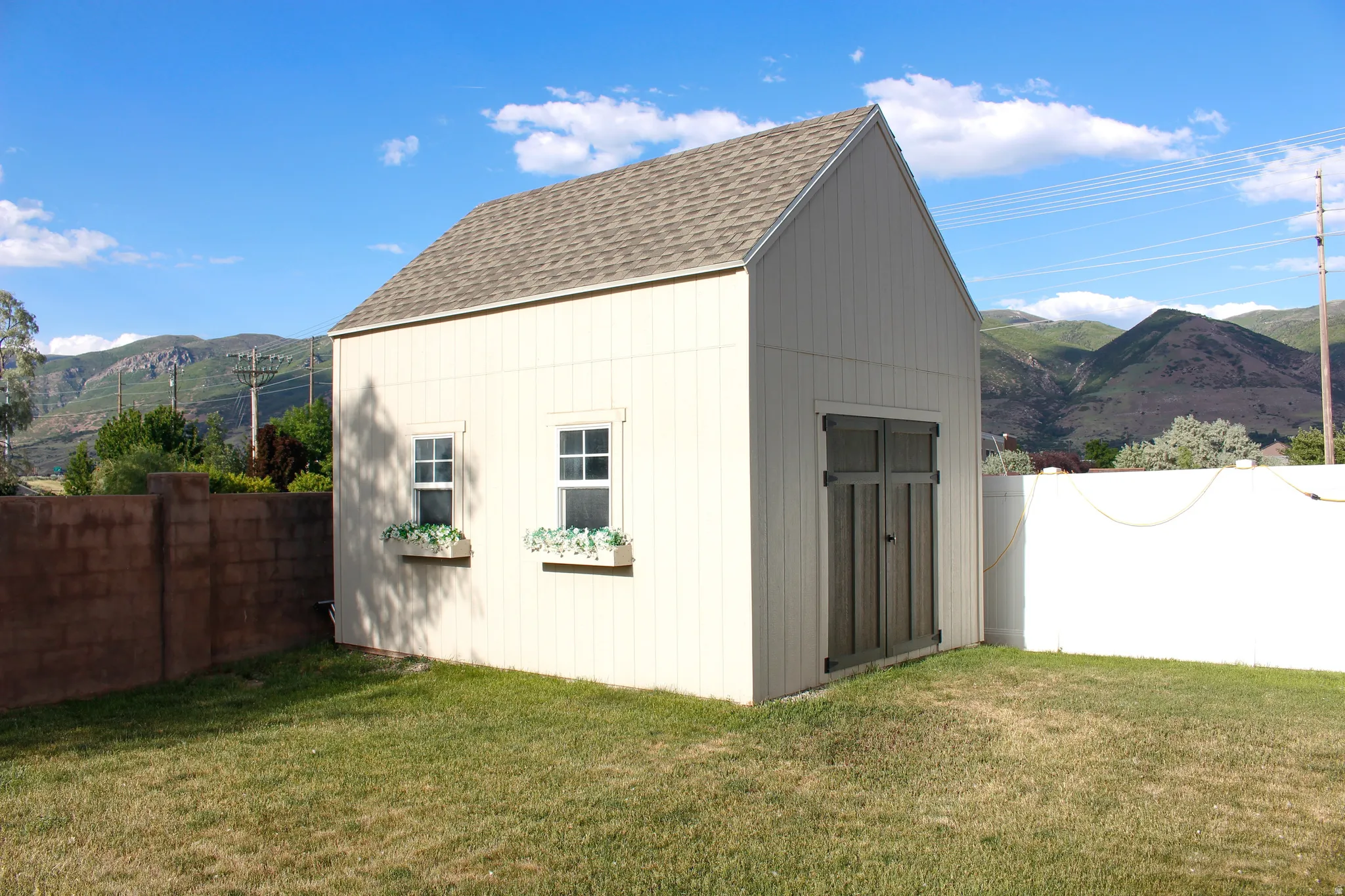 Large new shed with double doors for easy access!  Window boxes add to the charm!