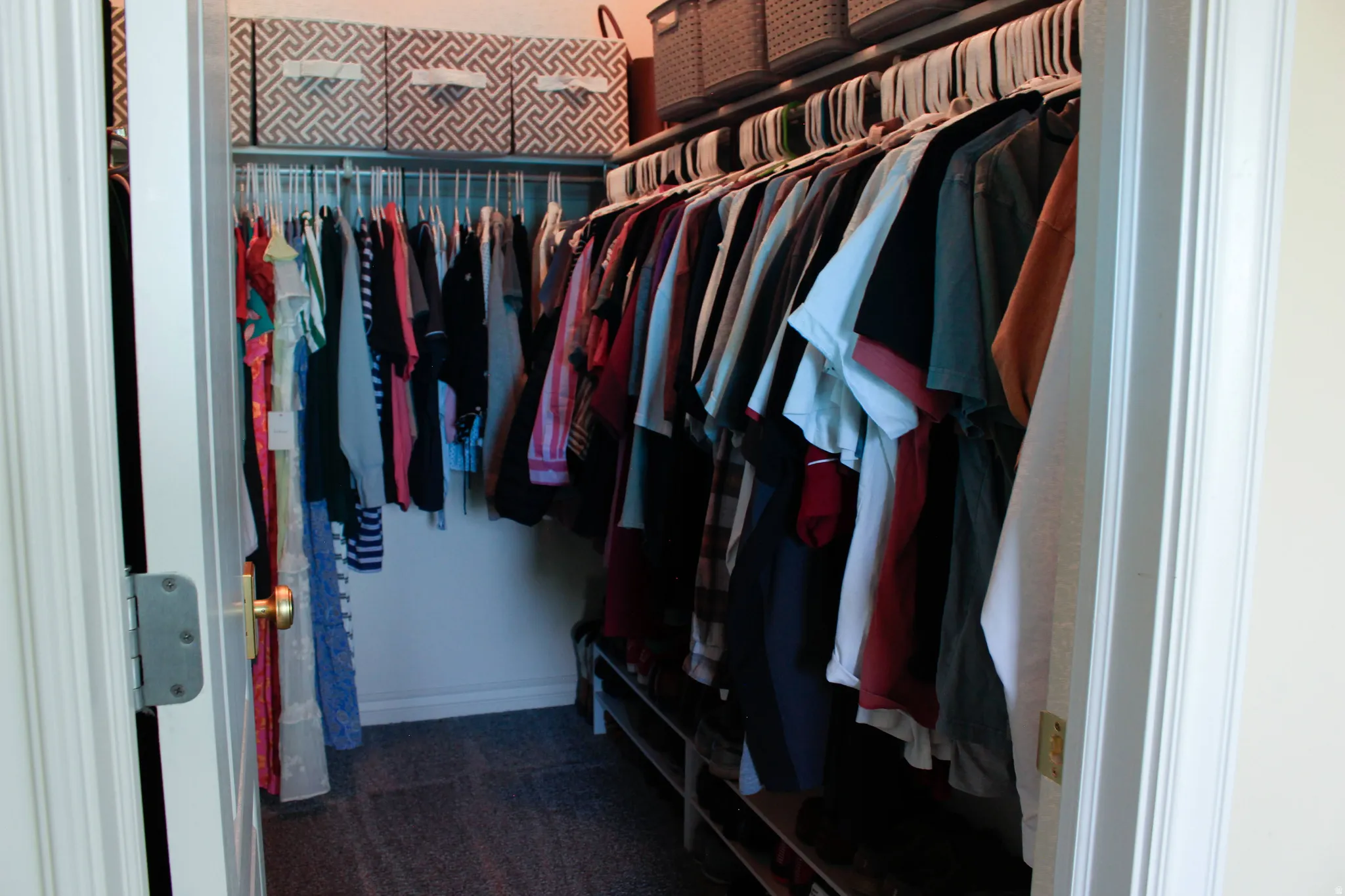 Primary bedroom large walk-in closet.