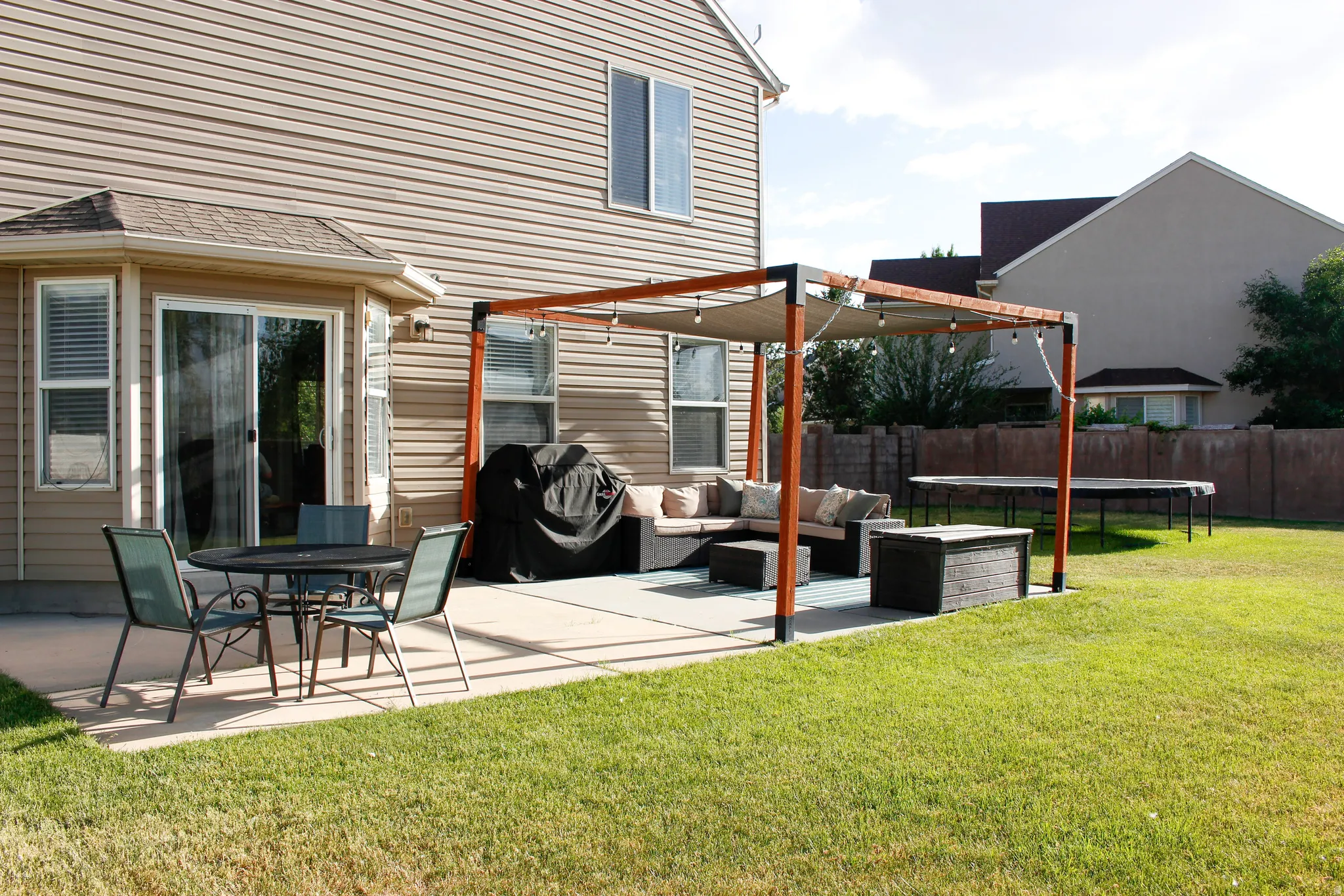 Spacious, secluded backyard with concrete patio and convenient access to the kitchen/dining. Fully fenced!