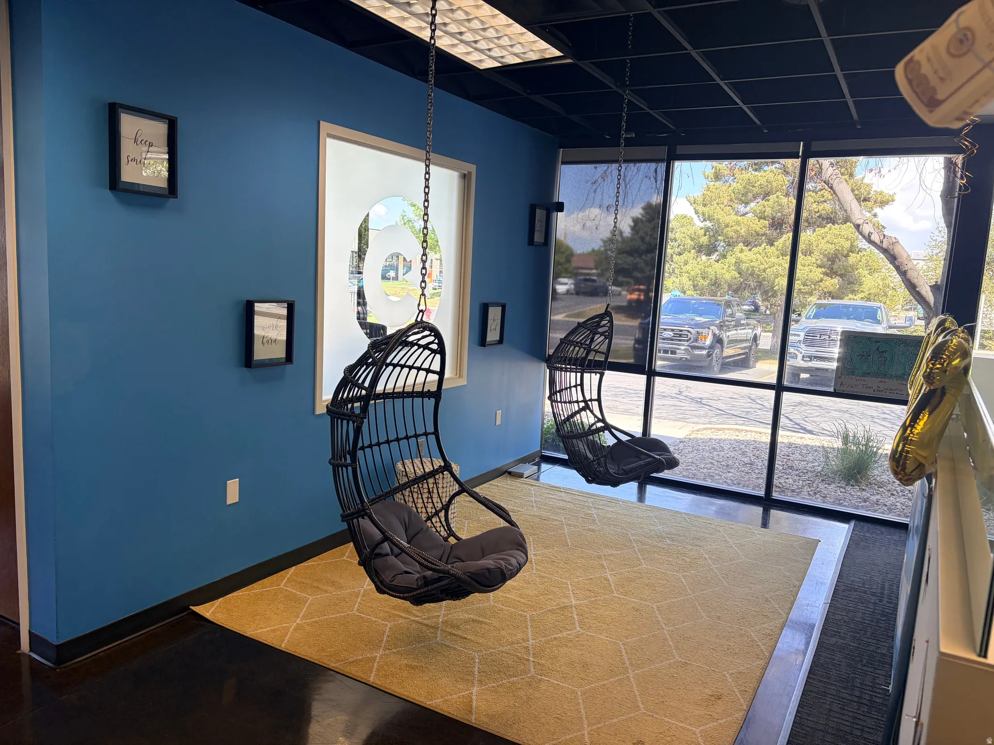 Interior space featuring blue painted walls and dark wood-finish flooring