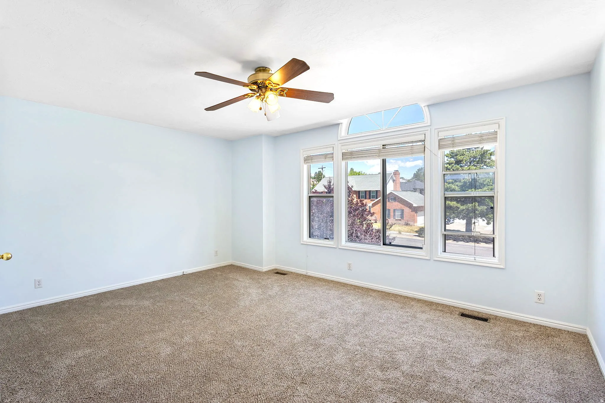 Bedroom #2, Spacious room featuring light blue walls and brown carpet flooring