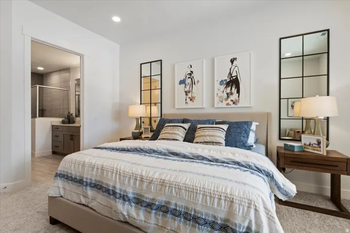 Bedroom featuring light-colored carpeting and recessed lighting