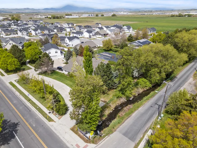 Aerial perspective showcasing a residential area with varied home styles and mature landscaping