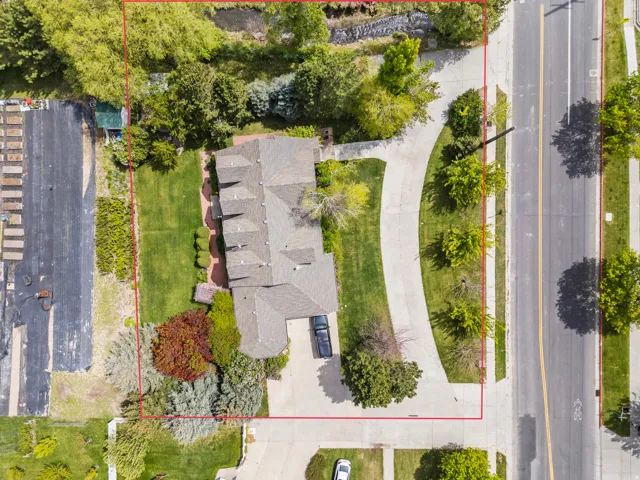 Spacious residential property featuring a multi-gabled roofline and an extensive driveway