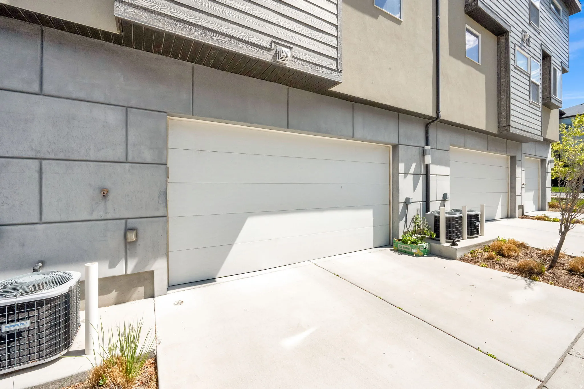 Modern exterior with horizontal siding and block-style accent panels